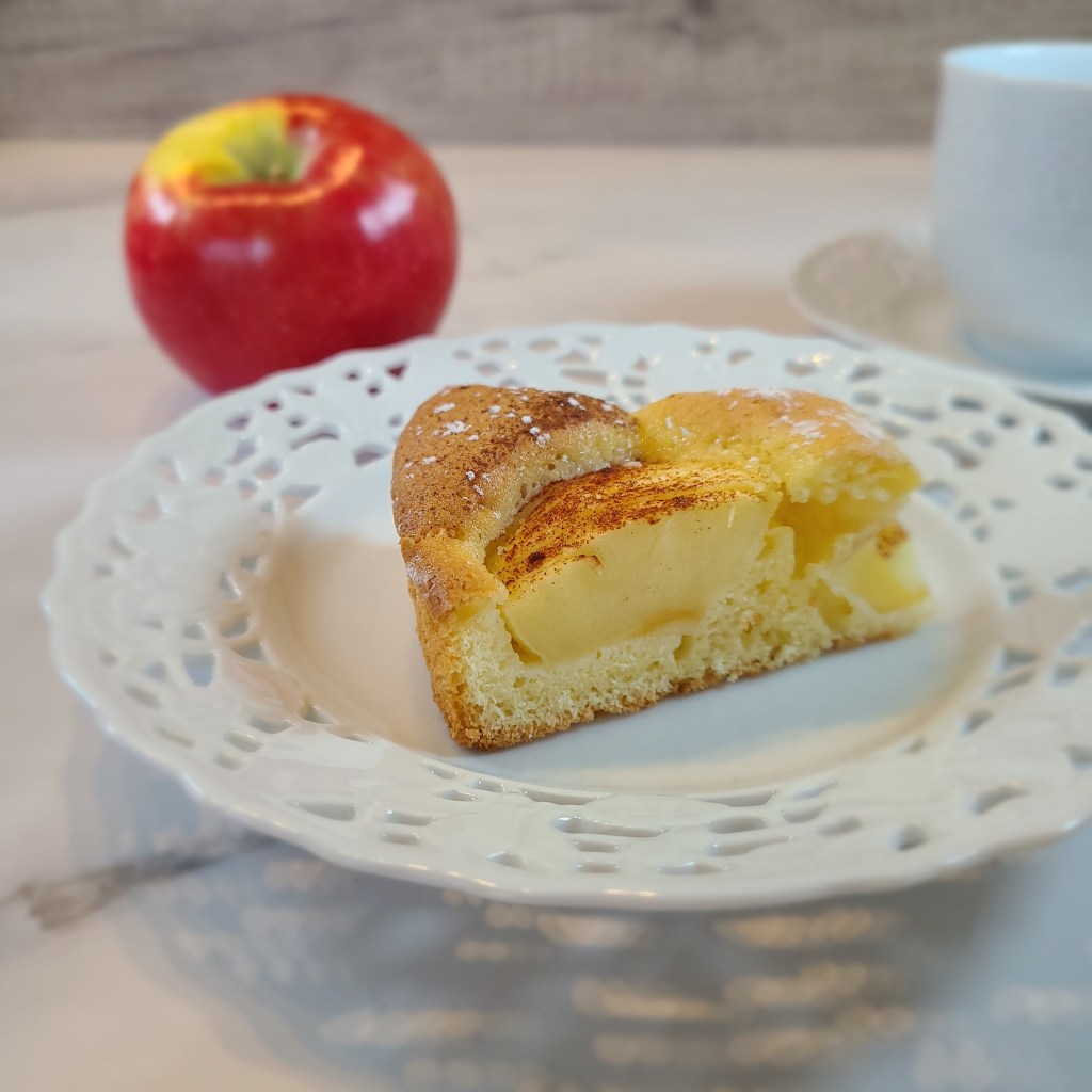A very classy German apple cake. 
The cake looks so simple but it has a very light and fluffy texture, the apples are a juicy addition and some cinnamon on top adds to the apple and vanilla taste.