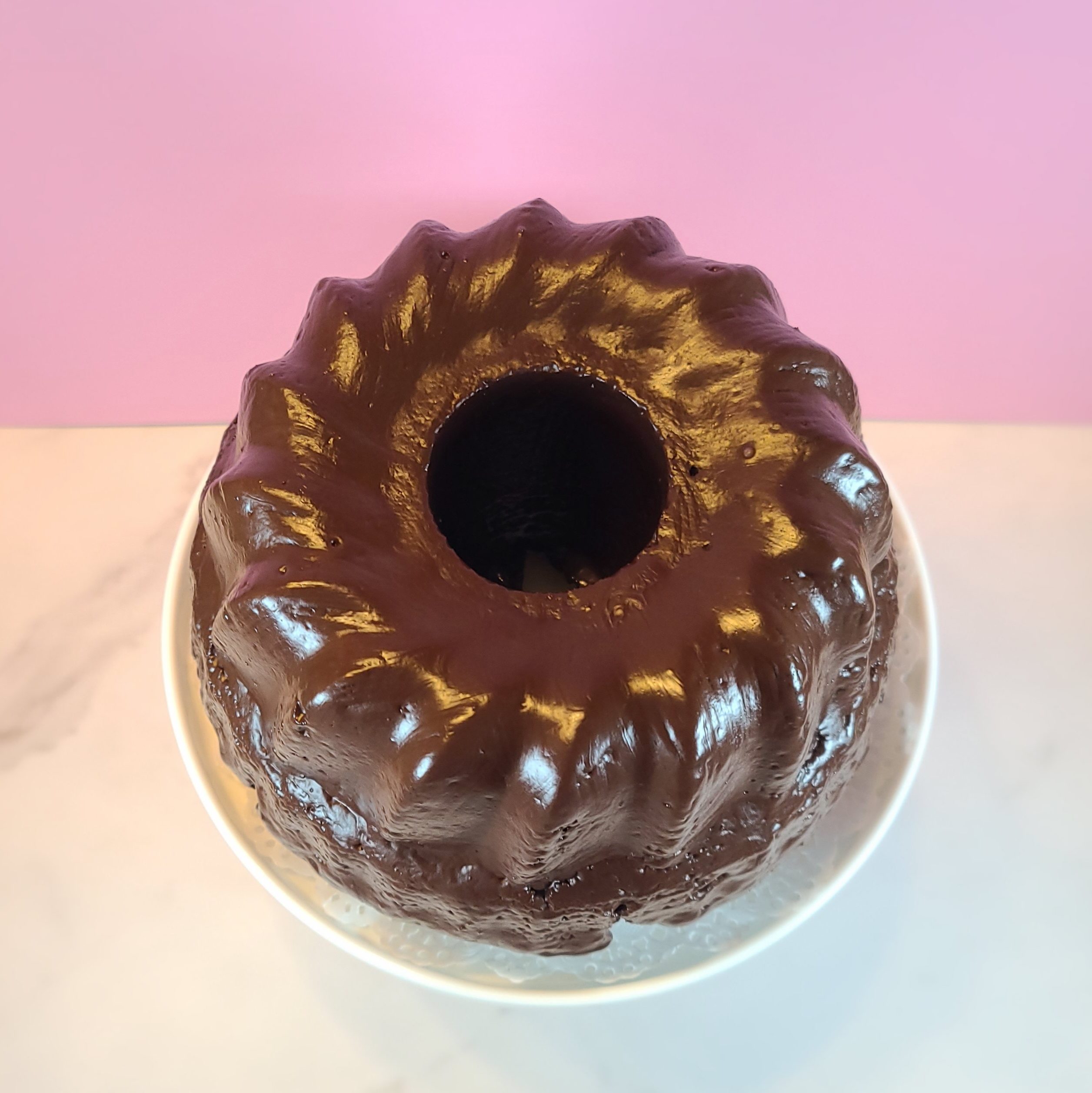 Chocolate glaze (Schokoladen Glasur) 
The chocolate glaze is a typical cover, besides plain powdered sugar or lemon sugar glaze and helps to hold moisture inside the cake.