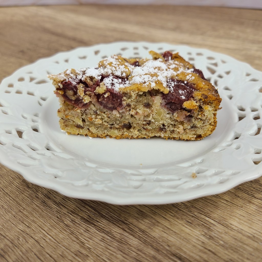 One of my fruit cakes. The bottom is a moist mix of nuts and chocolate topped with sour cherries.